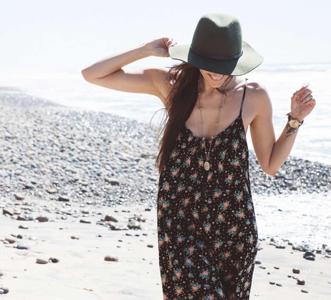 Woman wearing a beach dress and a hat