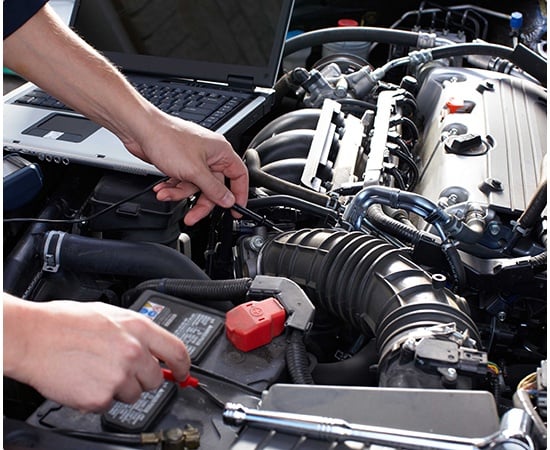 Automotive technician performing diagnostic