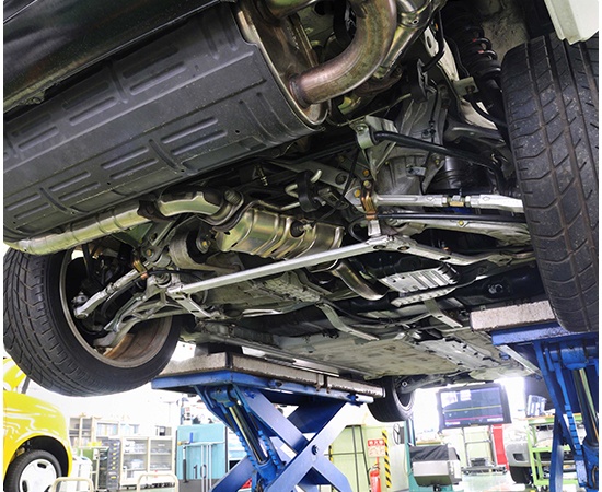 Bottom view of a car on a lift