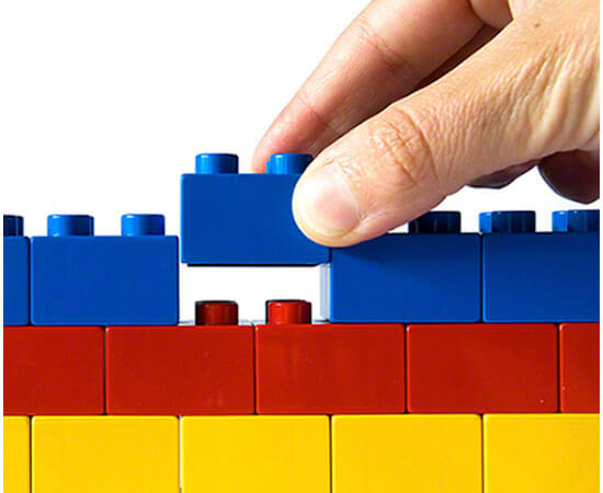 Person playing with lego bricks 