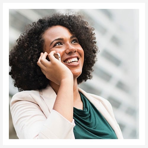 Smiling businesswoman talking on a mobile phone