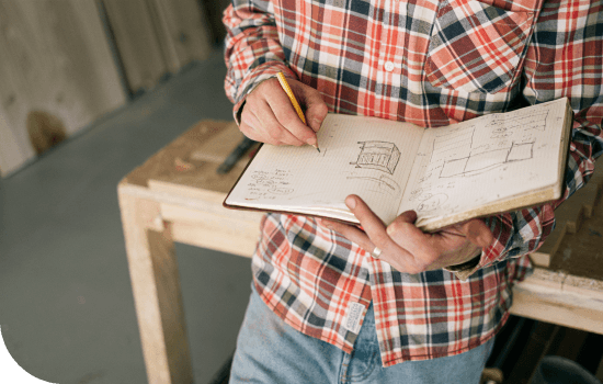 Person sketching in a notebook