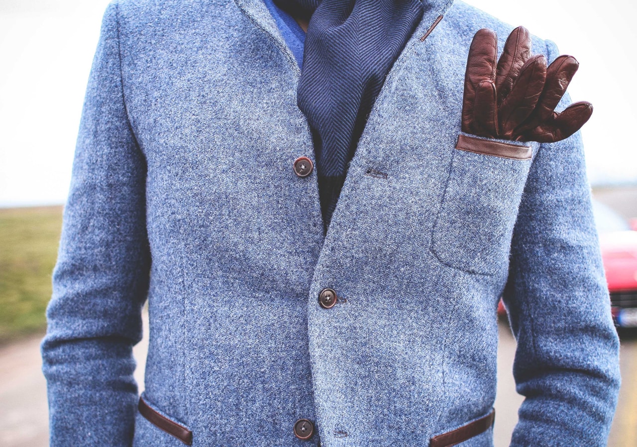 Close up of a man wearing a woolen suit